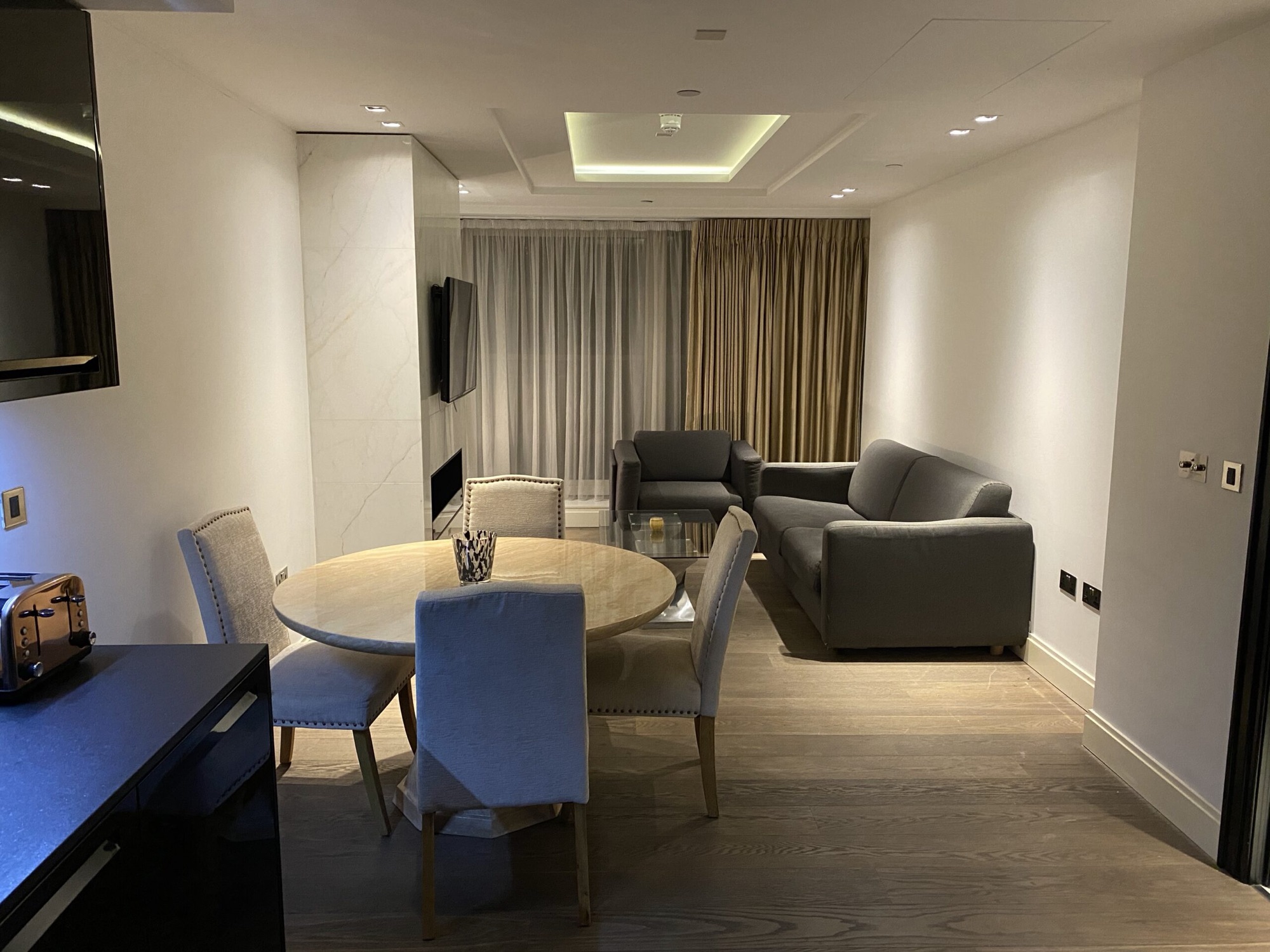 Dining and living space in a managed apartment
