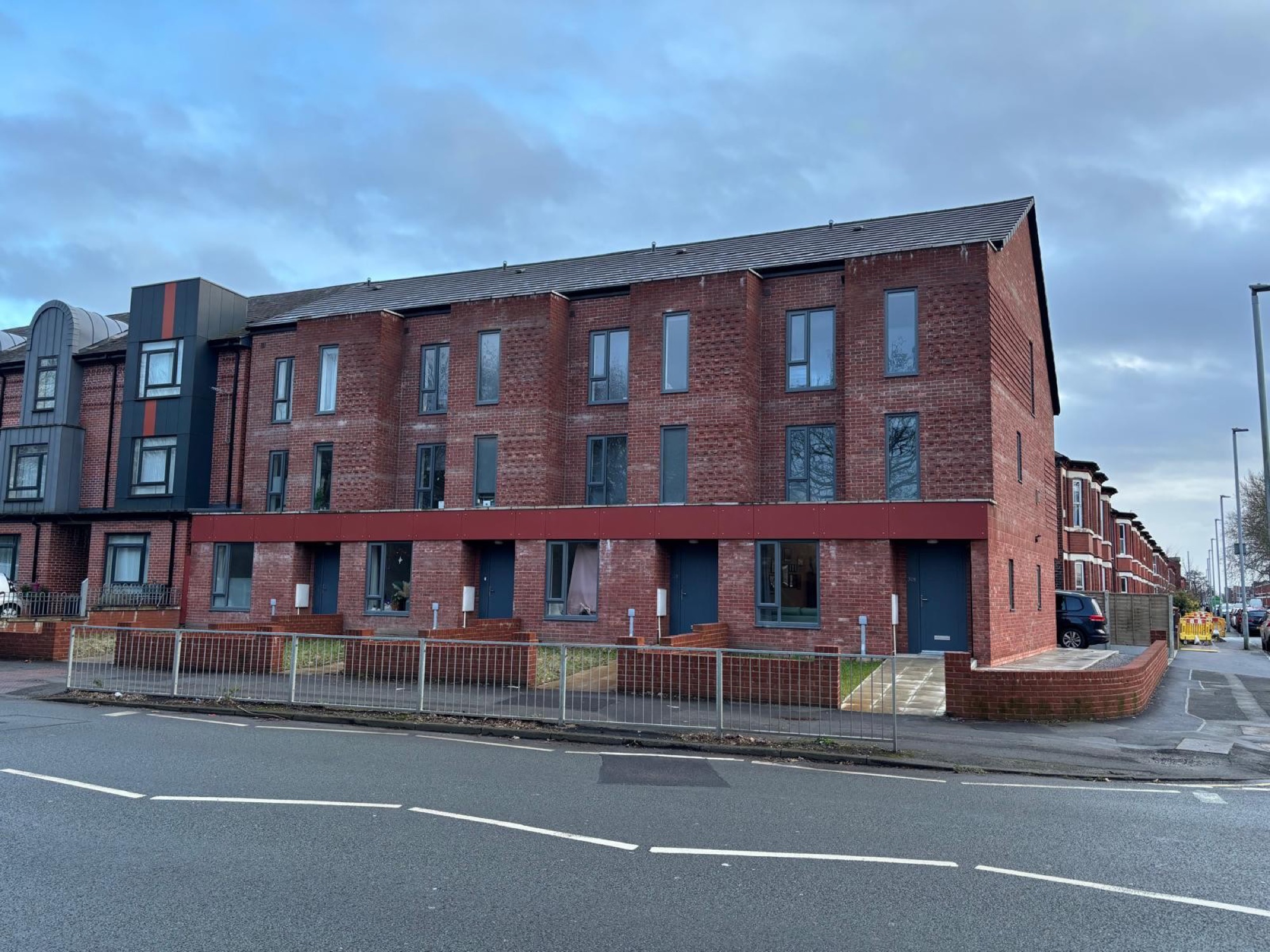 Moss Lane East, a new red-brick terrace in Moss Side